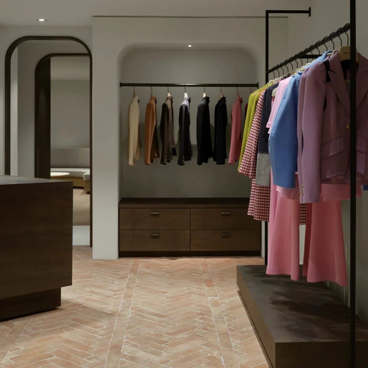 Inside SMYTHE's Toronto store — tailored jackets on racks in a warm, minimal space